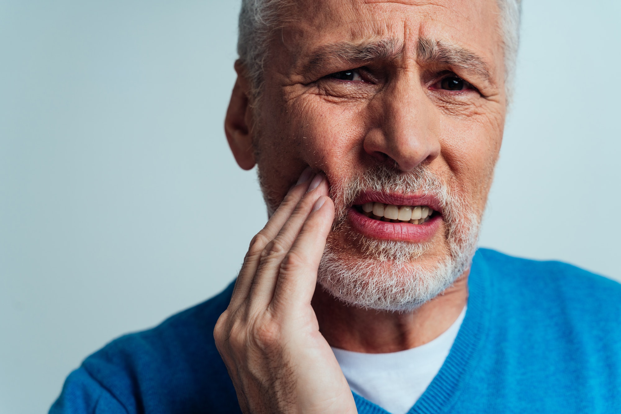 gum pain in back of mouth