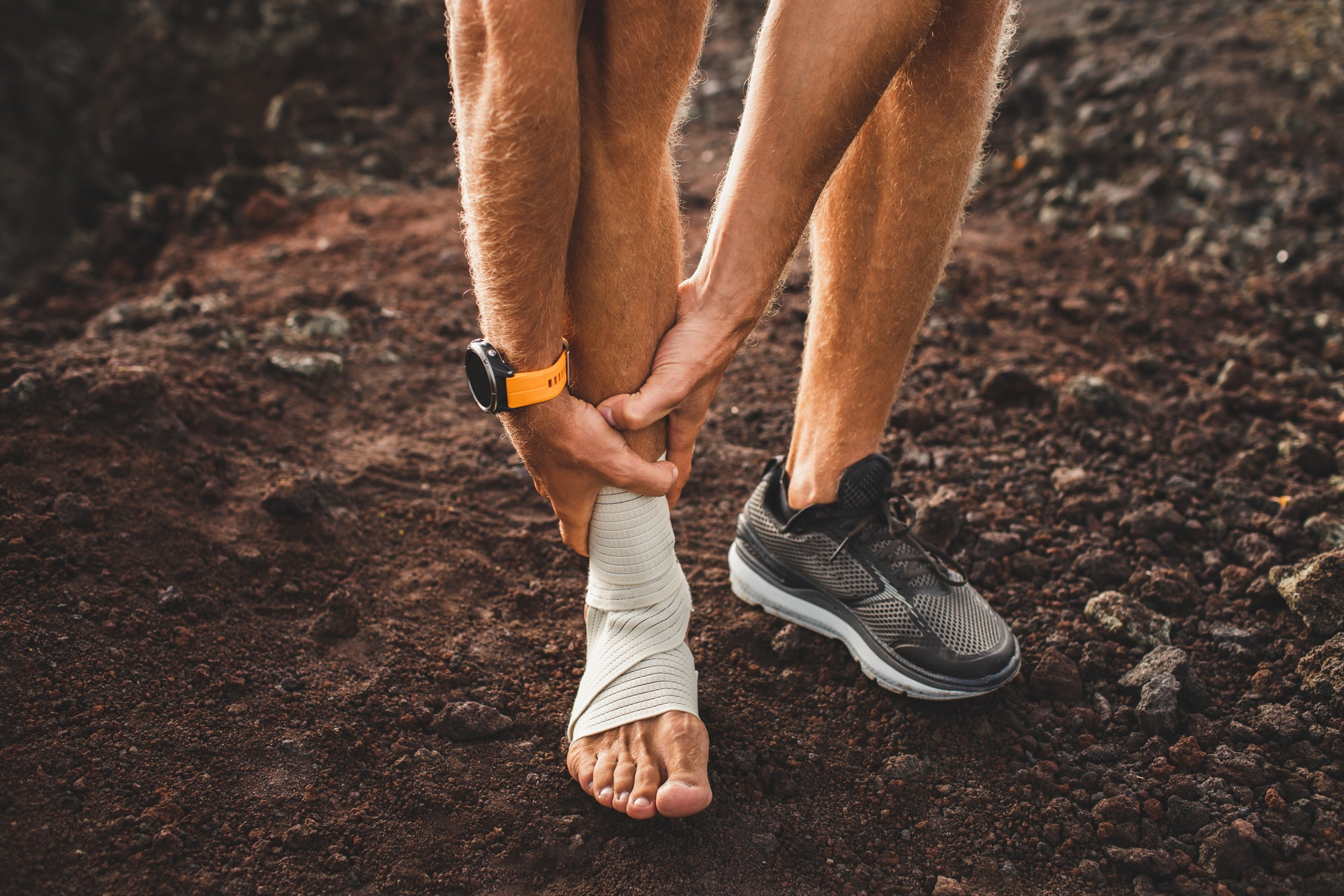 Male Runner Holding Injured Leg Close Up And Suffering With Pain Leg Injury Sprain Ligament 